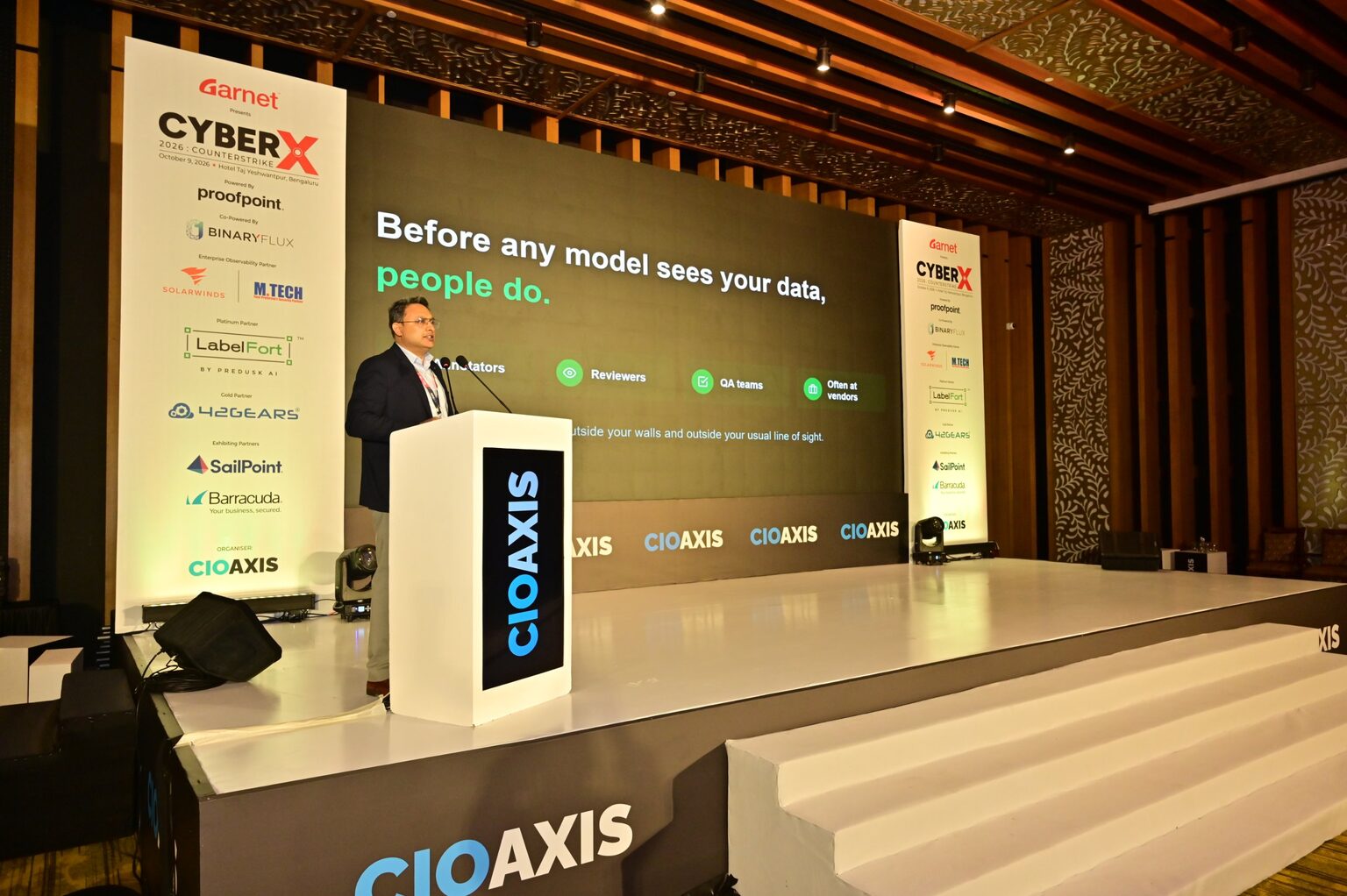 Chirayu Vaidya presenting 'Who sees your data before your model does?' at CyberX 2026, Bengaluru